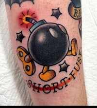 a tattoo with a bomb on it